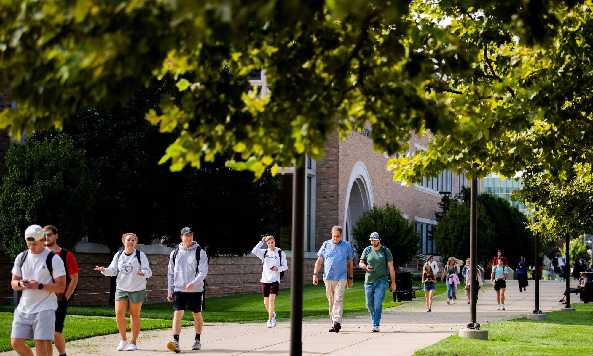 students walking across pew campus